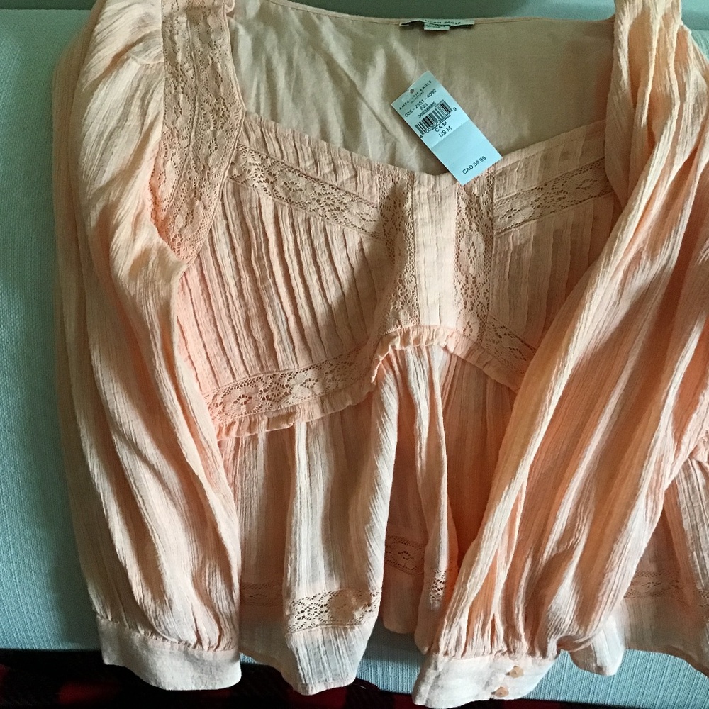 American Eagle peachy lace like shirt.